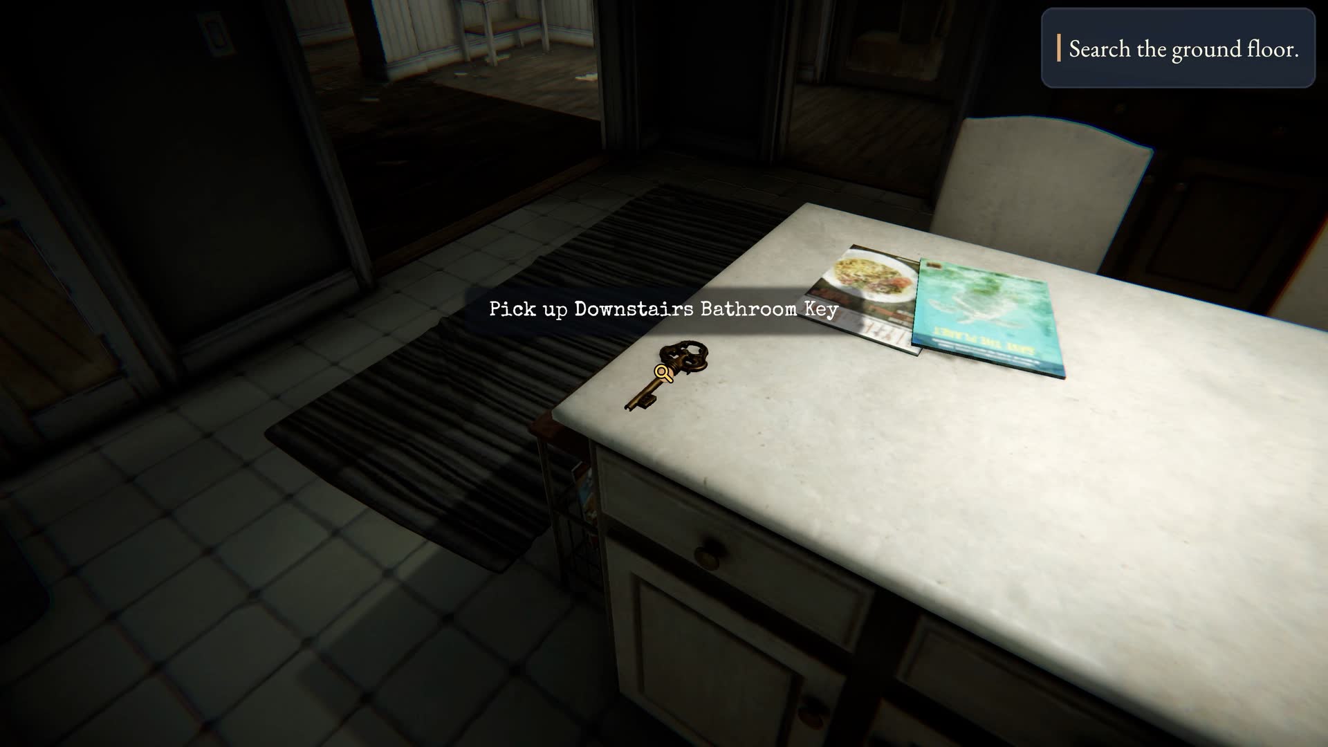 Hollowmere — A kitchen table with a set of keys and a folded document beside a reading lamp