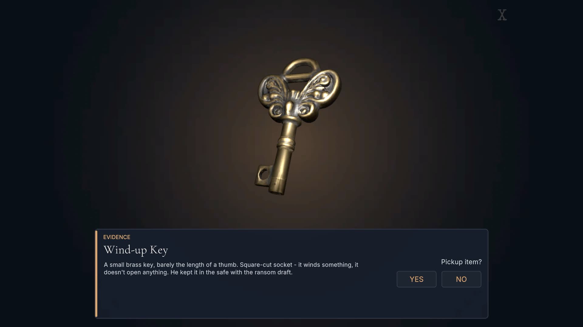 A brass wind-up key held in the examine view